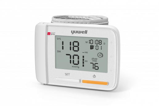 Yuwell YE8900A digital wrist blood pressure monitor showing readings on a large LCD screen with a gray cuff and yellow power button.